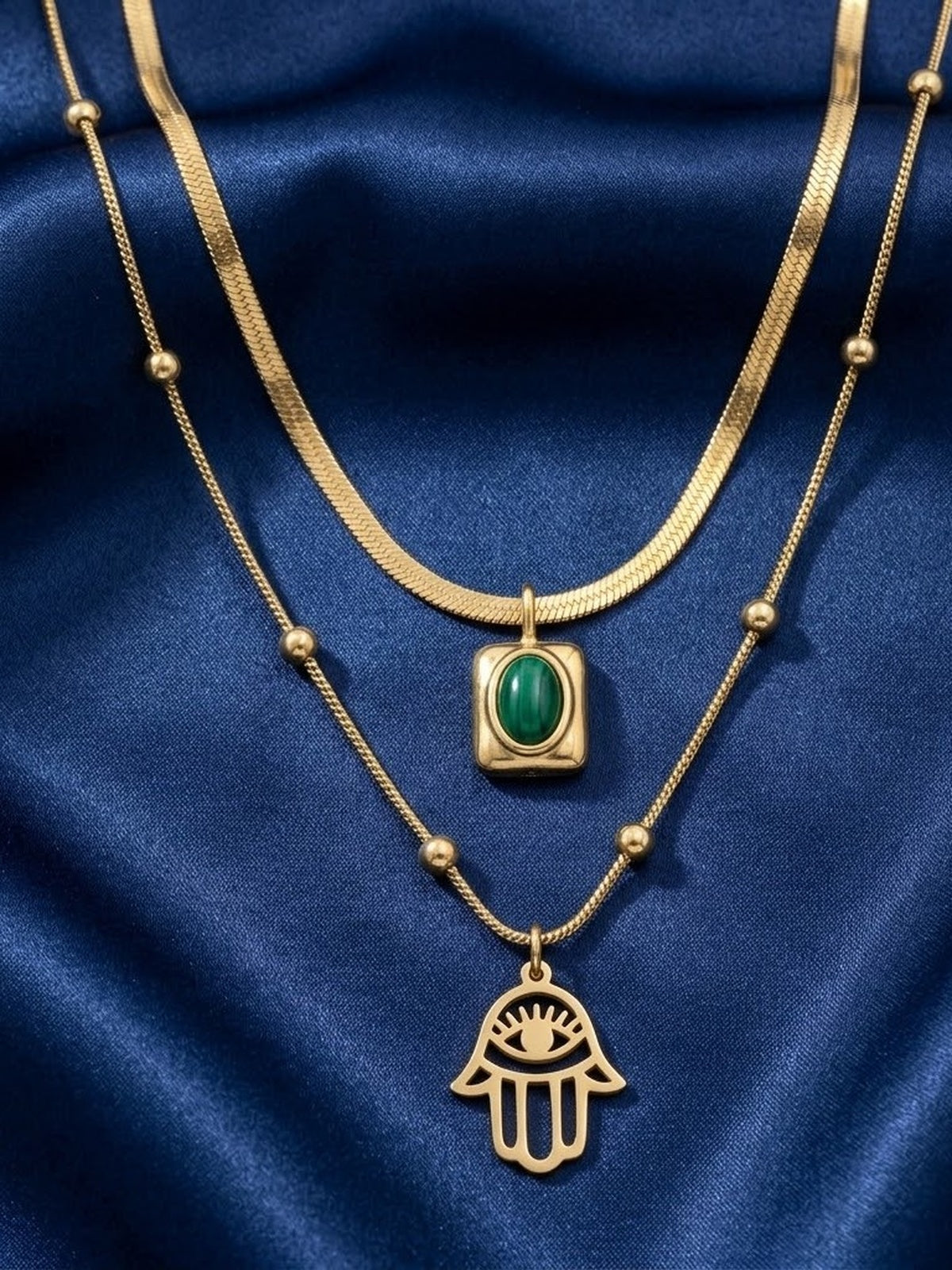 Golden emerald hamsa layered necklace