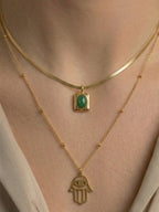 Golden emerald hamsa layered necklace