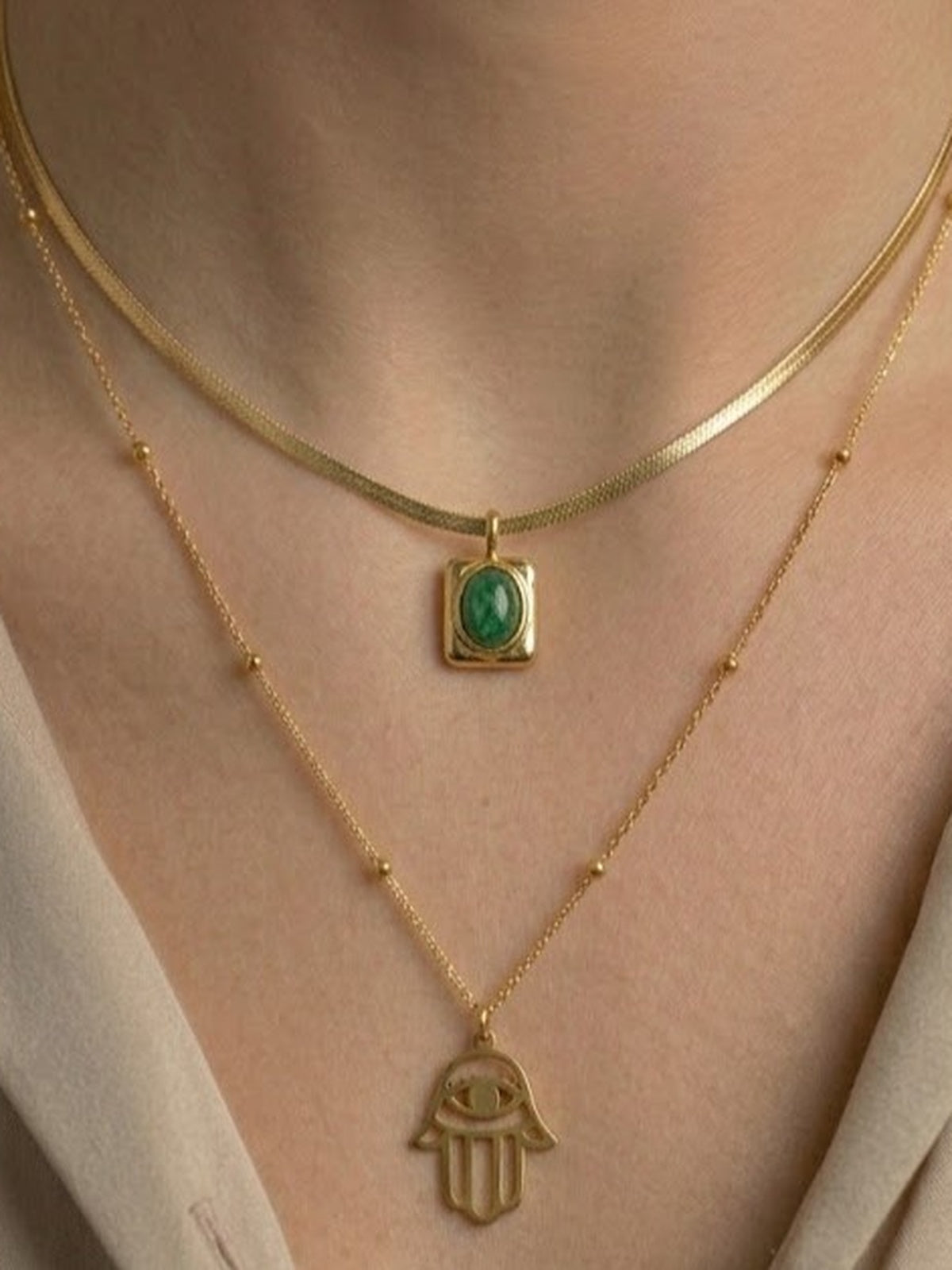 Golden emerald hamsa layered necklace